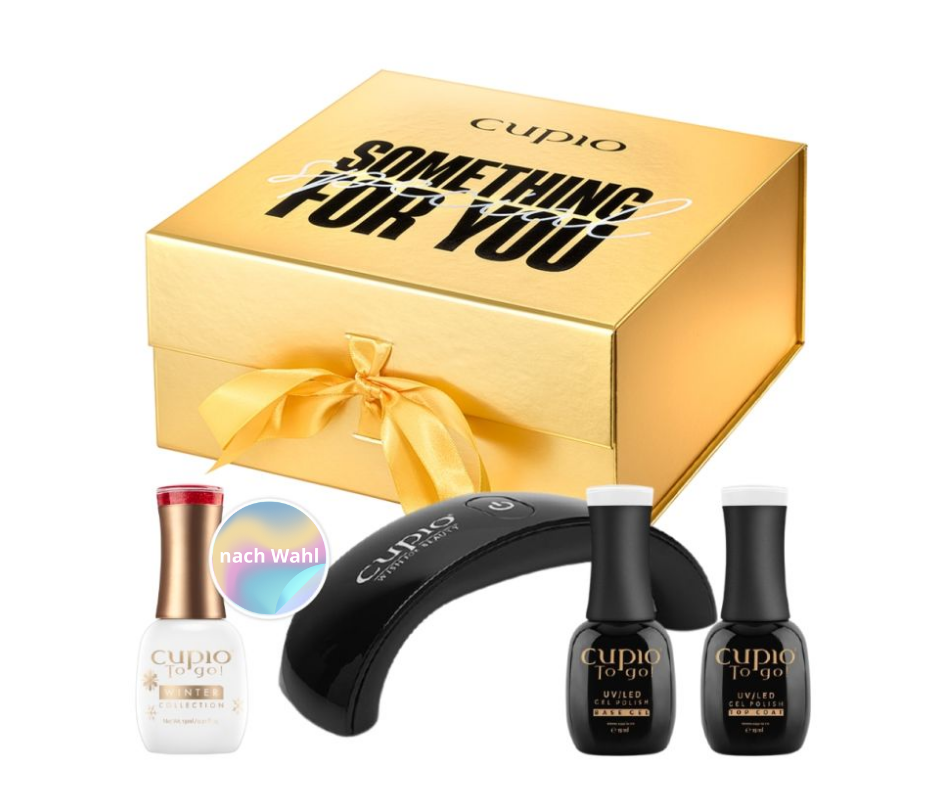 Goldene Geschenkbox von Cupio mit Nagelpflegeprodukten, inklusive UV/LED Lampe und Nagellacken