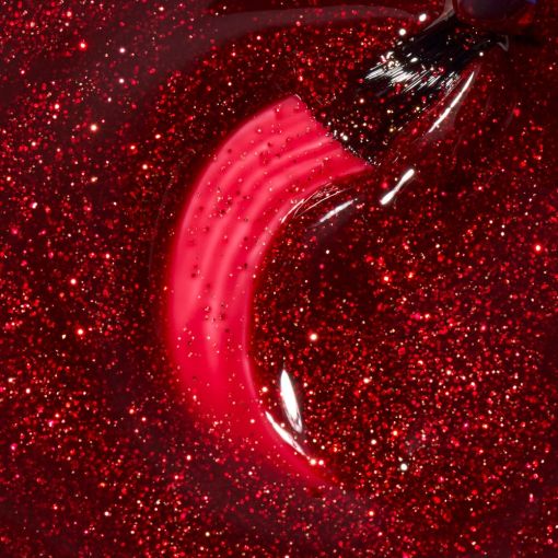 Pinsel in rotem glitzerndem Nagellack